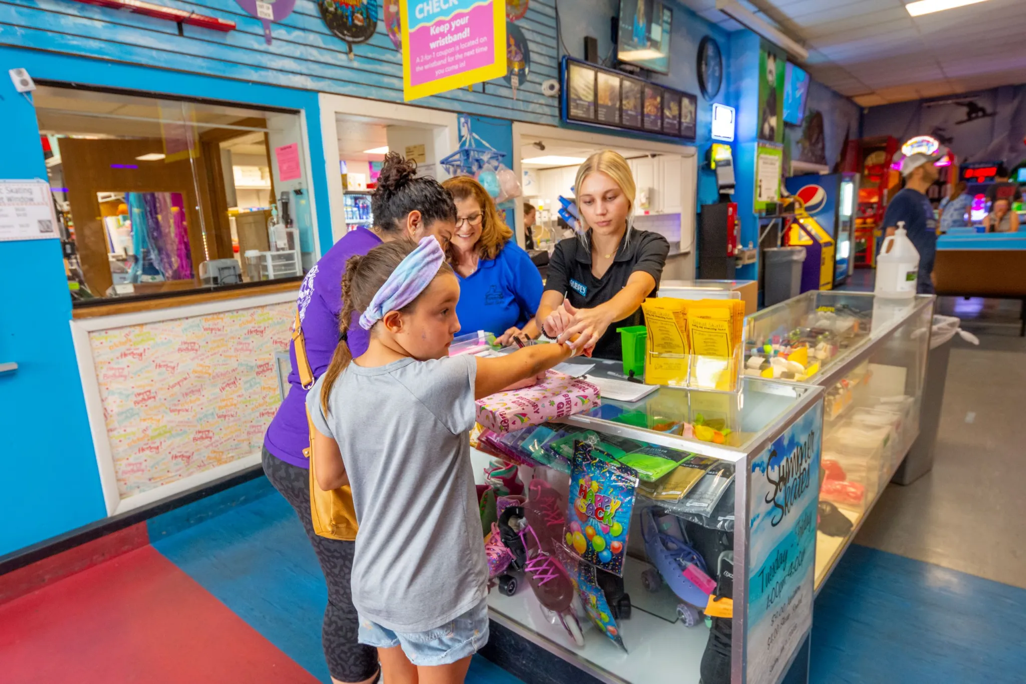People choosing prizes in arcade shop